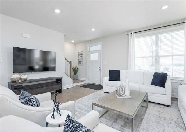 living room with light hardwood / wood-style flooring