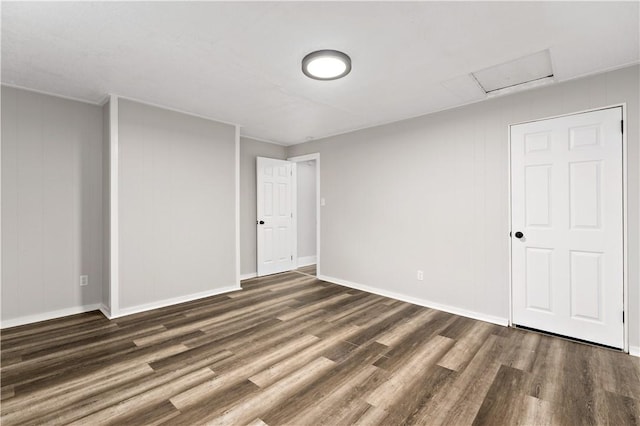 unfurnished room with dark hardwood / wood-style floors