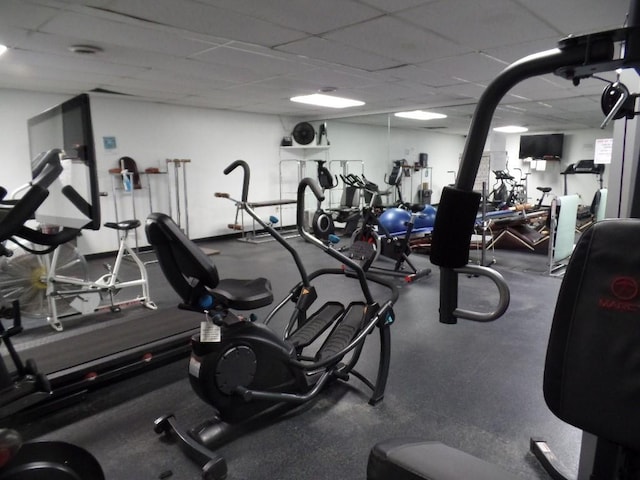 workout area with a paneled ceiling