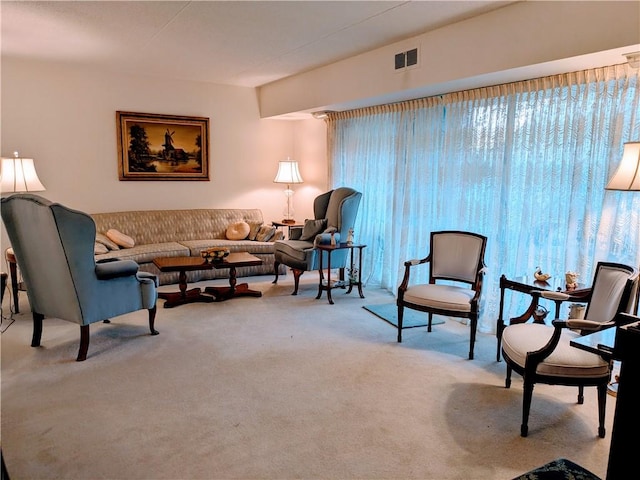 carpeted living area with visible vents