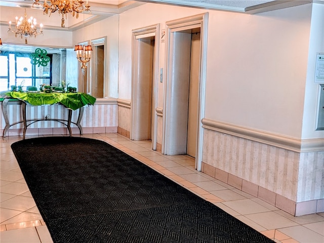 building lobby with a wainscoted wall and ornamental molding