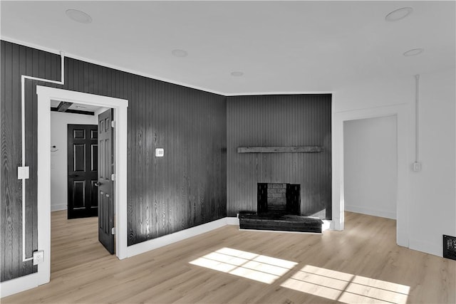 unfurnished living room featuring light hardwood / wood-style floors