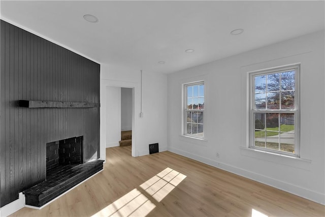 unfurnished living room featuring light wood-type flooring