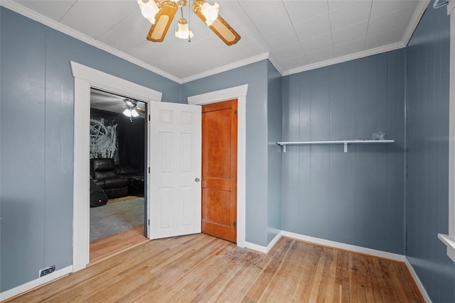 unfurnished bedroom with crown molding, ceiling fan, and light wood-type flooring