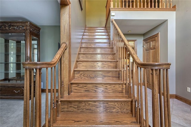 stairway featuring tile patterned floors