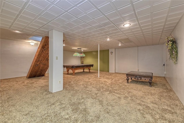 basement featuring pool table and carpet flooring