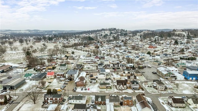 snowy aerial view featuring a residential view