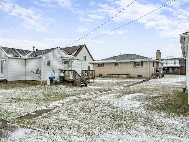 back of house with a wooden deck