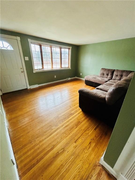 living room with light hardwood / wood-style flooring