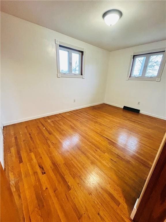 empty room featuring hardwood / wood-style floors