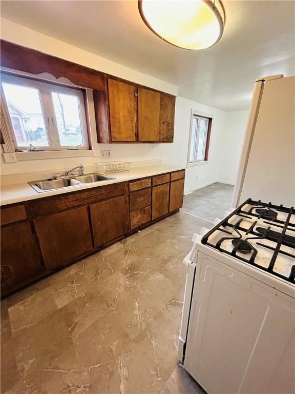 kitchen with sink and white appliances