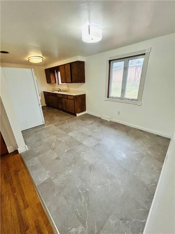 kitchen featuring dark brown cabinets