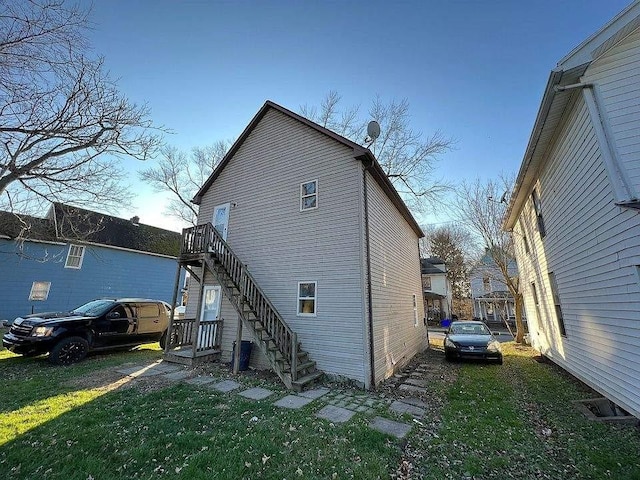 rear view of house with a lawn