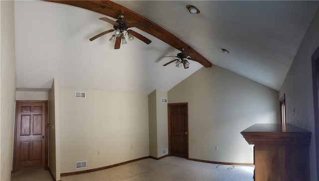 interior space featuring lofted ceiling with beams and light colored carpet