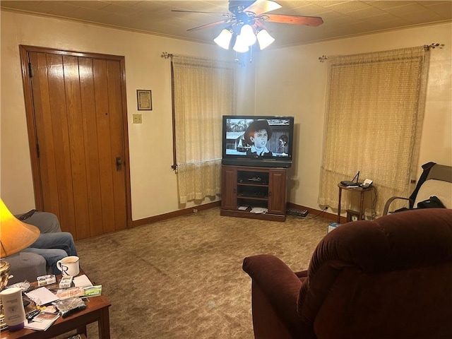 carpeted living room featuring ceiling fan