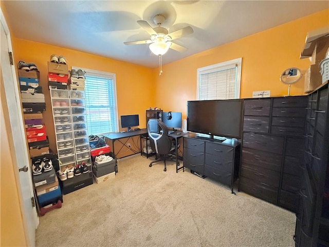 carpeted office with ceiling fan