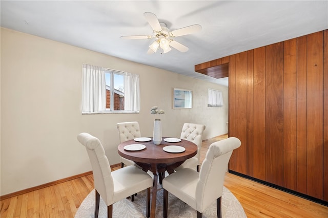 dining space featuring ceiling fan and light hardwood / wood-style flooring