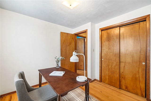 office with light hardwood / wood-style flooring