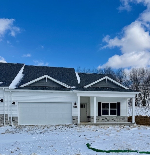 view of front facade with a porch and a garage