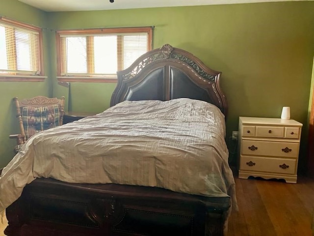 bedroom featuring dark hardwood / wood-style floors