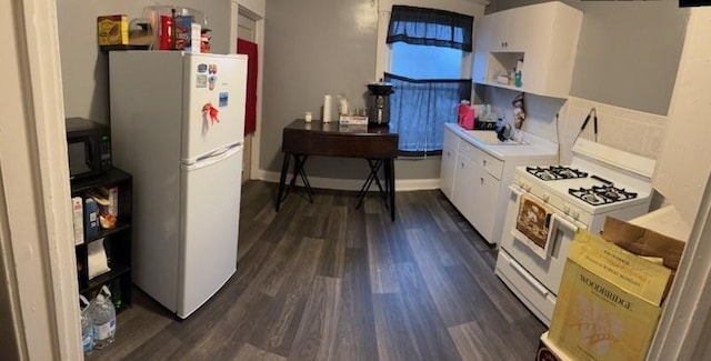 561/563 Sherman Ave, Sharon, PA 16146 - kitchen with white appliances, white cabinets, dark wood-style floors, and light countertops