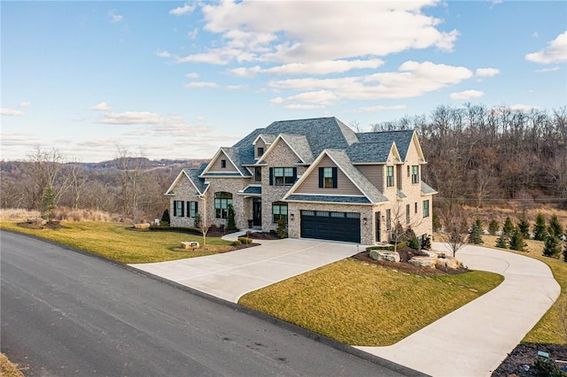 craftsman house featuring a garage and a front yard