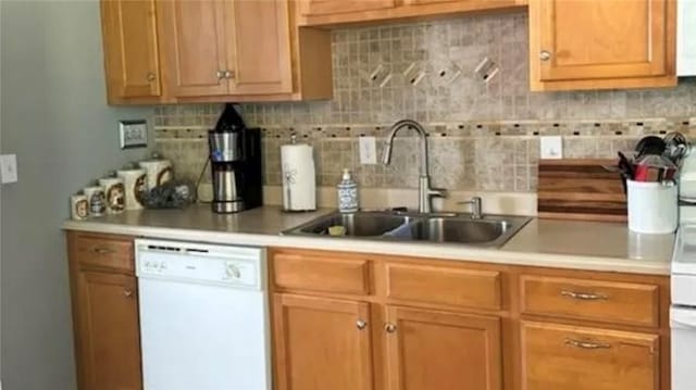 kitchen with sink, decorative backsplash, and dishwasher