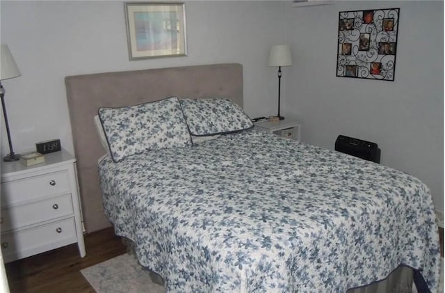 bedroom featuring dark hardwood / wood-style floors