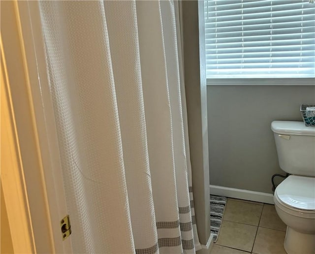 bathroom featuring tile patterned floors and toilet