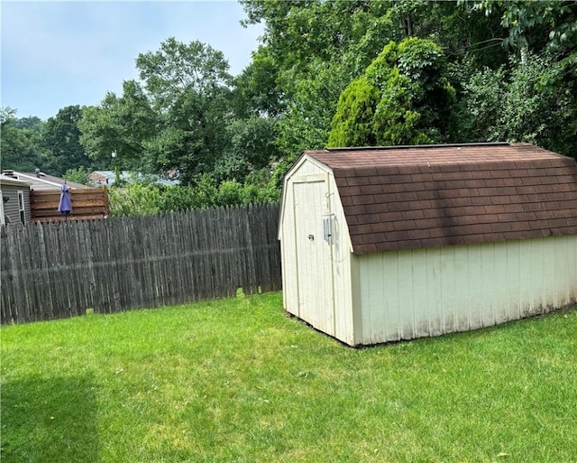 view of outdoor structure with a lawn