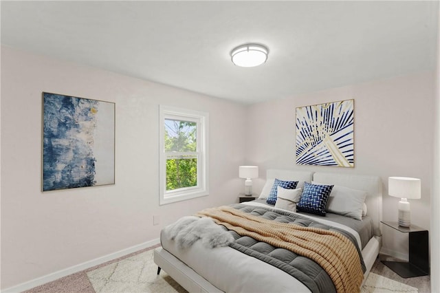 bedroom featuring light carpet