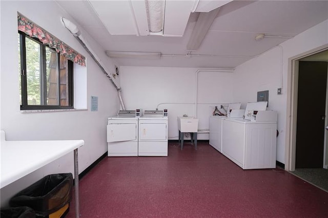 washroom featuring sink and washer and clothes dryer