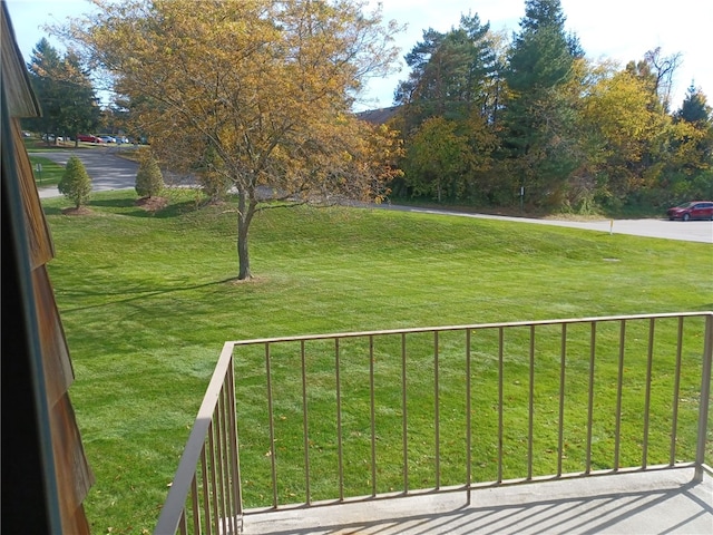 view of yard with a balcony