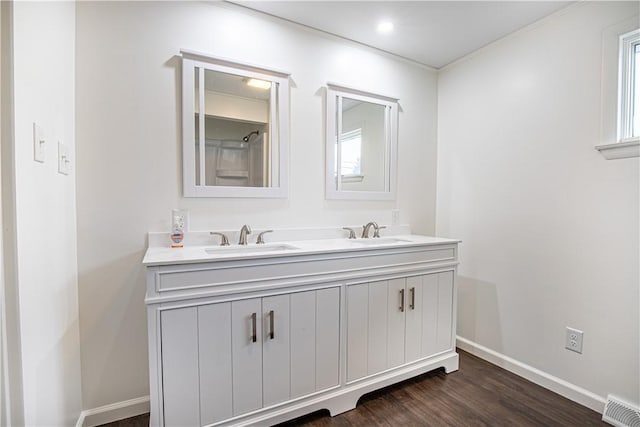 bathroom with hardwood / wood-style flooring and vanity