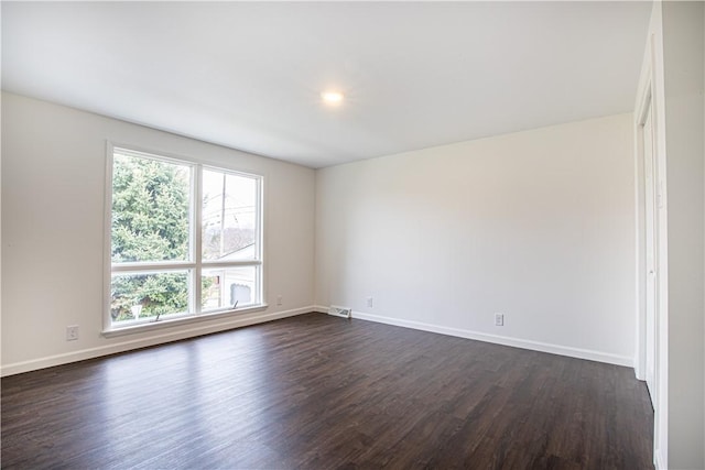 unfurnished room featuring dark hardwood / wood-style floors