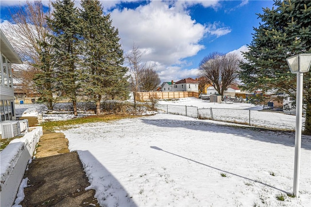 view of yard layered in snow