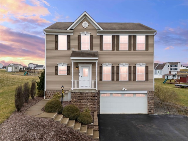 view of front of property with a garage