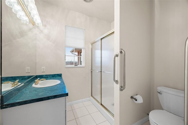 bathroom featuring vanity, tile patterned floors, toilet, and walk in shower