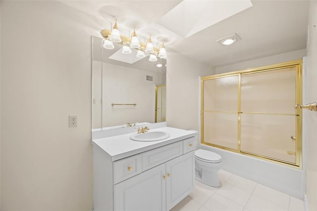 full bathroom featuring vanity, tile patterned flooring, toilet, and combined bath / shower with glass door