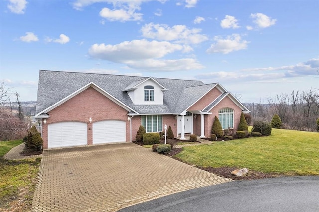 view of front of home featuring a garage and a front yard