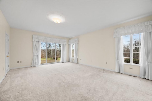 empty room featuring light colored carpet