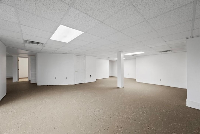 basement featuring a paneled ceiling