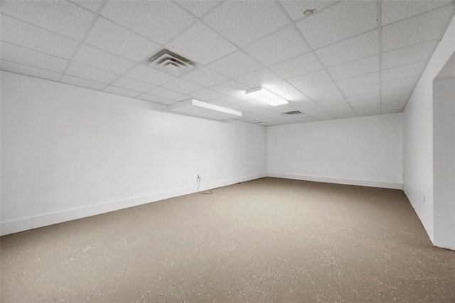 empty room with a paneled ceiling