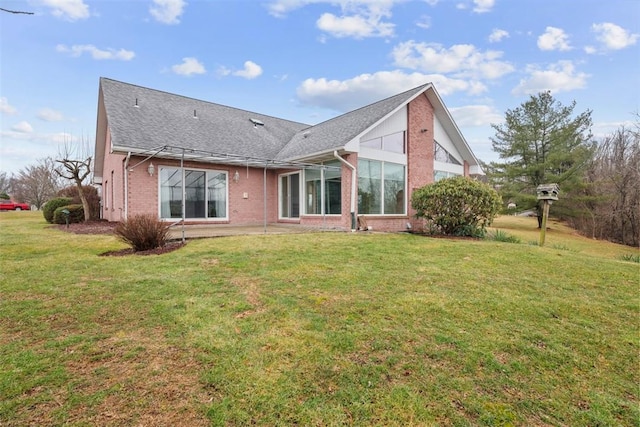 back of house featuring a yard