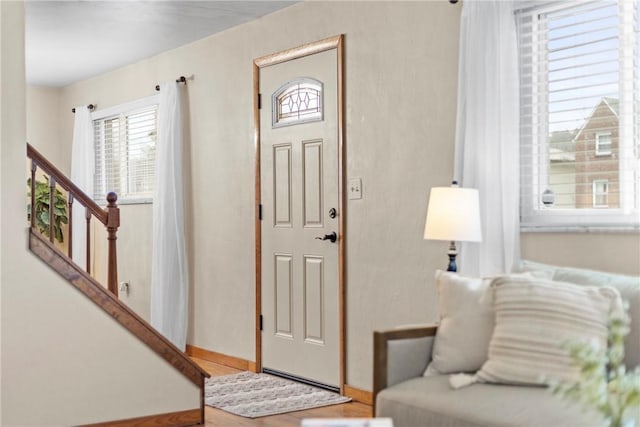 entrance foyer featuring hardwood / wood-style flooring