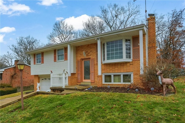 split foyer home with a front yard and a garage