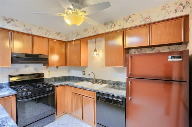 kitchen featuring tasteful backsplash, black appliances, ceiling fan, sink, and dark stone countertops