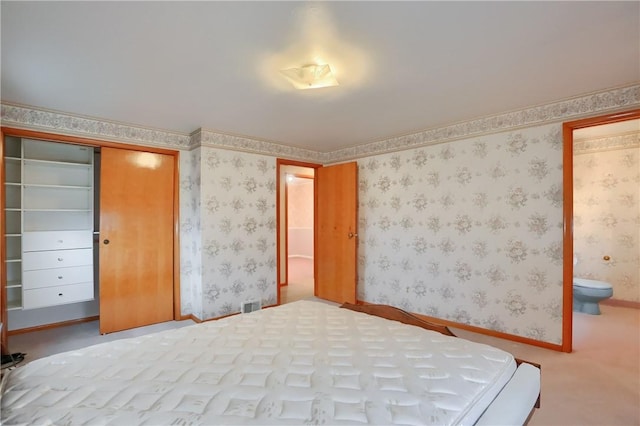 unfurnished bedroom featuring carpet floors and a closet