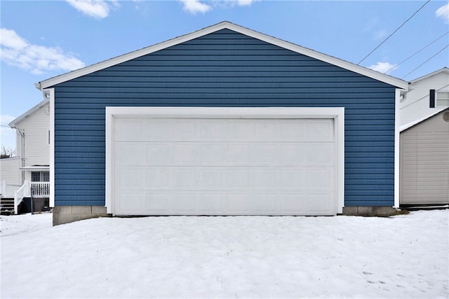 view of snow covered garage