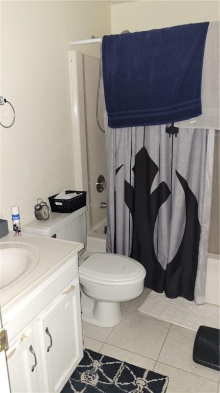 full bathroom featuring tile patterned floors, toilet, shower / bath combo, and vanity